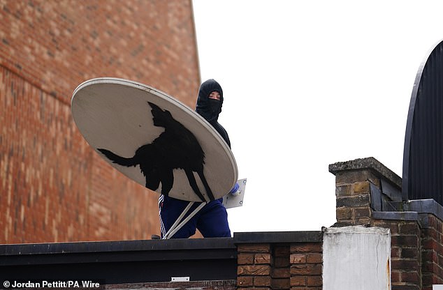 Another Banksy work, an image of a lone wolf on a satellite dish in Peckham, mysteriously disappeared last month with images showing hooded men dismantling and removing the dish.