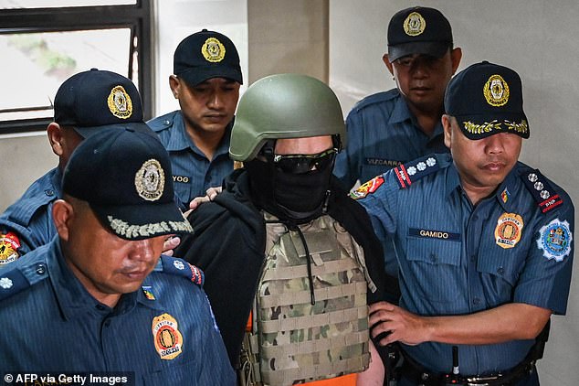 The 74-year-old man was taken to the heavily guarded Pasig courthouse in handcuffs, wearing a bulletproof helmet and bulletproof vest this morning.