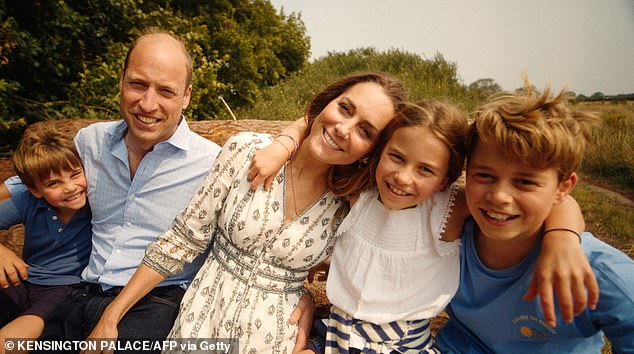 The Prince and Princess of Wales smile with their three children in the recently released video