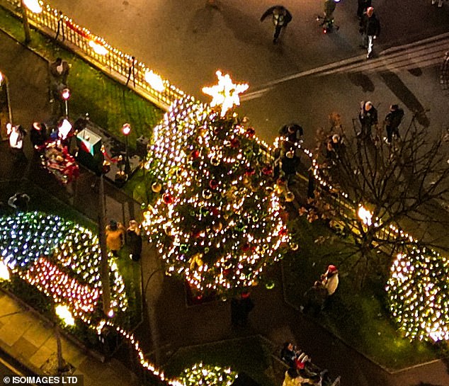 In the center of the square a large Christmas tree was placed with a star on top.