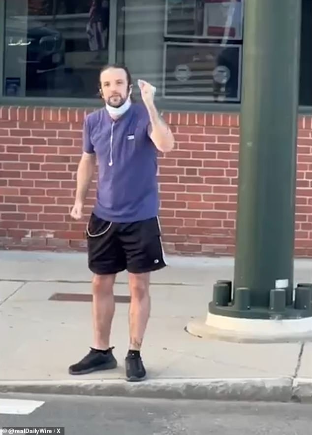 The altercation began after this man, who was wearing a badge with the Palestinian flag, began accusing the protesters of 