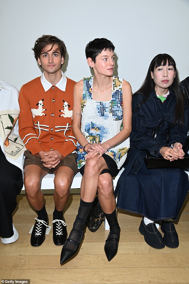 The actor, who identifies as non-binary, paired a pair of sheer black socks with the look and rocked a pair of pointy black heels.