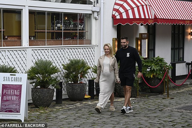 Meanwhile, her boyfriend Oliver cut a relaxed figure in a black Burberry monogram sweatshirt and shorts.