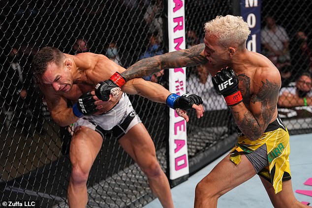 Oliveira defeated Chandler by knockout to claim the vacant UFC lightweight title in December 2021