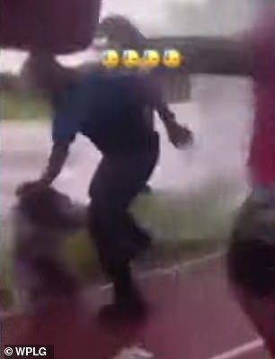 Due to the altercation, a Miami-Dade Schools Police officer intervened and pulled her from a nearby crowd before throwing her to the ground.