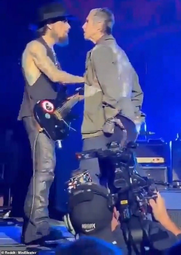 Perry Farrell, right, approached guitarist Dave Navarro, left, and began punching him.