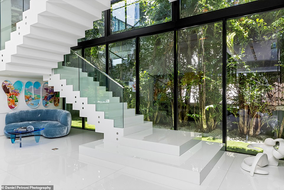 The interior of the house was designed by New York-based Jennifer Post Design and landscape architect Raymond Jungles.