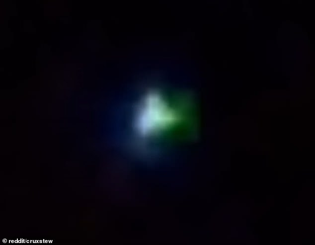 The video shows a small orb in the sky that rapidly changes color.