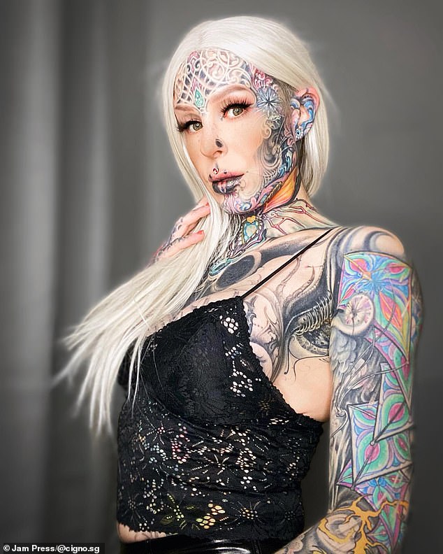 The 36-year-old's ink is inspired by a style of surrealism and biomechanical art, a specific art form that incorporates elements of machinery with organic matter.