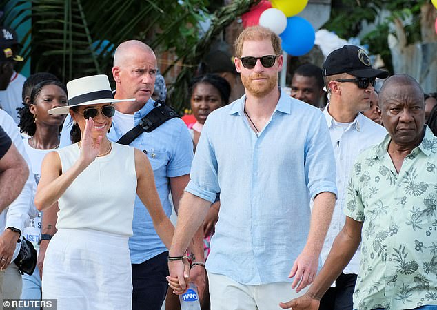 Where the Sussexes go, the Langers follow - here they are seen looking over their shoulders as they visited Colombia in August