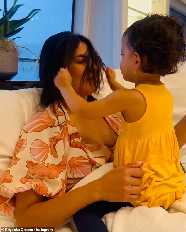 In another snap, the brunette beauty is seen playing with her two-year-old daughter Malti, as the little one happily played with her mother's long hair.