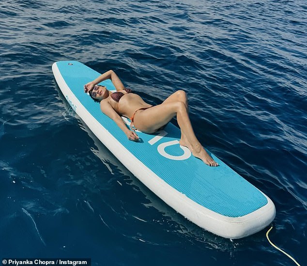 An aerial shot of the star showed more of her incredible figure as she reclined on a float in the middle of the ocean.