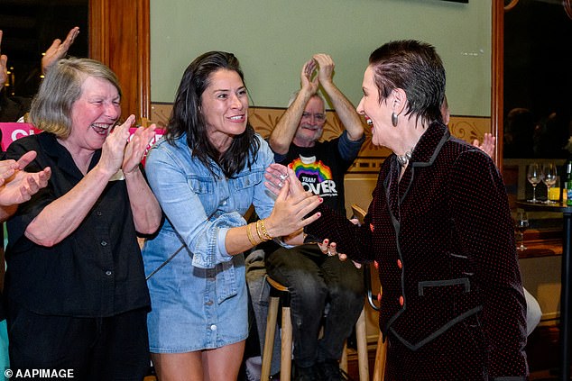 Clover Moore is pictured celebrating with fans on Saturday night at the Arthouse hotel in Sydney's CBD.