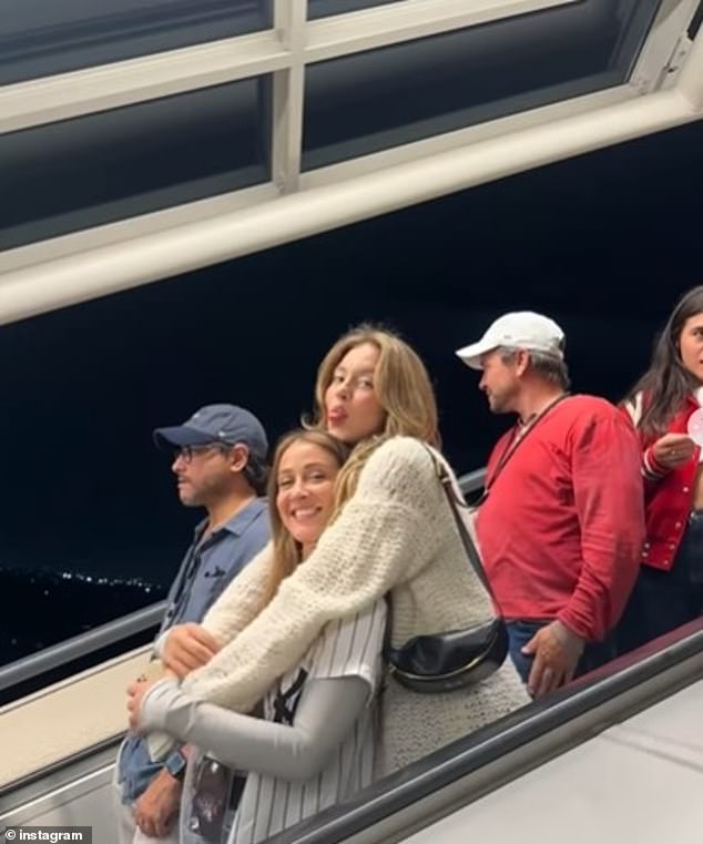 Other photos showed Sweeney hugging friends while on an escalator and dining at Buca di Beppo, where her loved ones surprised her with a custom cake.