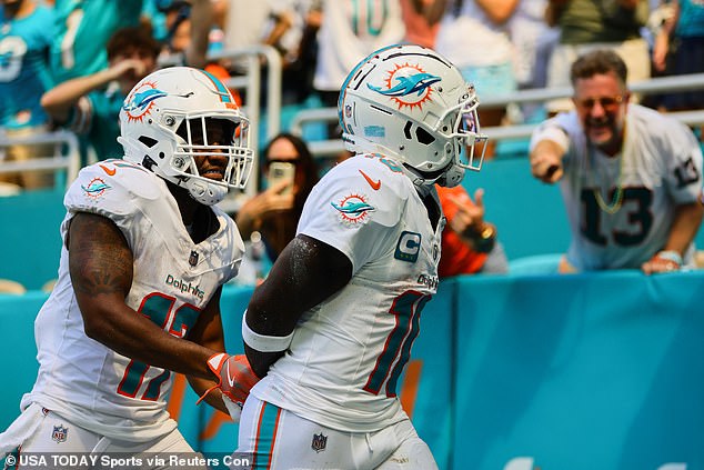 Hill and teammate Jaylen Waddle reenacted an arrest after the receiver's touchdown.