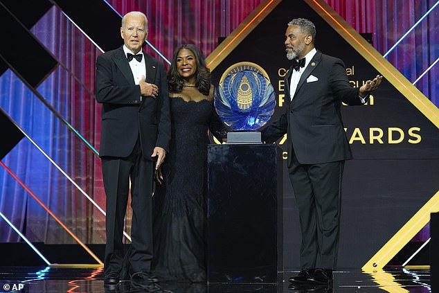 President Joe Biden (left) received a lifetime achievement award from Rep. Terri Sewell (center) and Rep. Steven Horsford at Saturday's Congressional Black Caucus Foundation Gala in D.C.