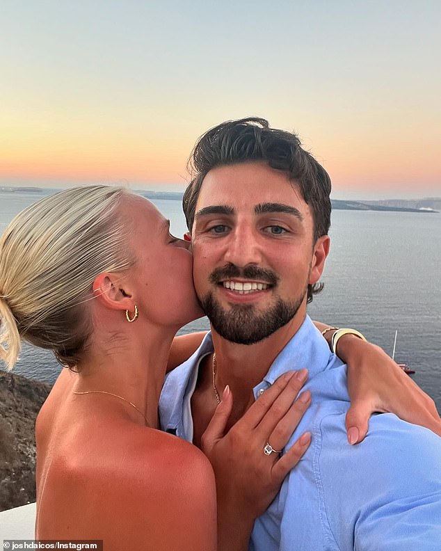 The couple cuddled up next to a stunning sunset and a picturesque canal. Model Annalise looked stunning in a sleeveless white dress and showed off her oval neckline.