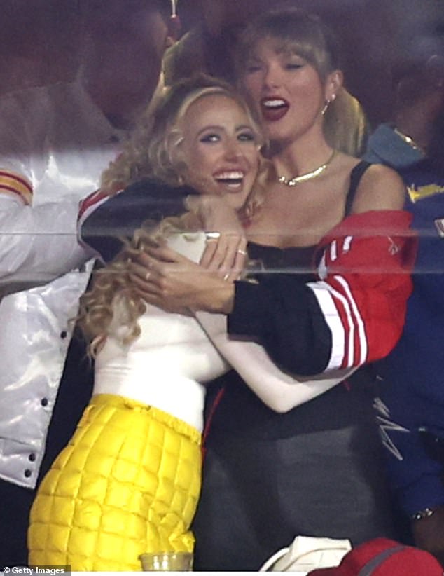 Taylor and Brittany hugged each other while watching the Chiefs beat the Broncos last year.