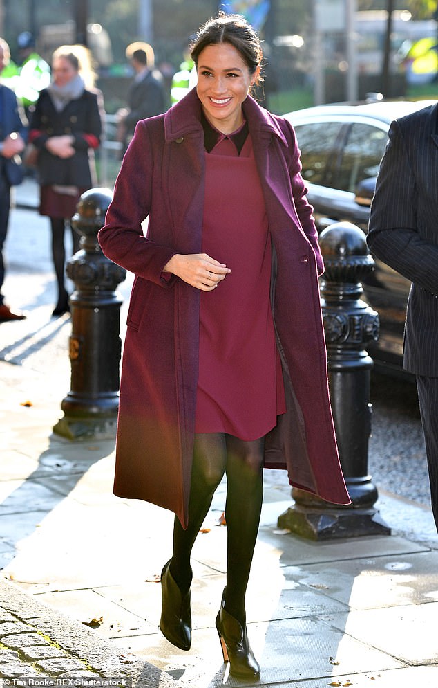 Pictured: Meghan Markle wore the $220 Sallyet dress and Daylina coat by Club Monaco in London in November 2018