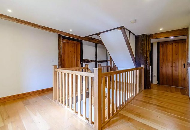 A look at the staircase and hallway of the 4,858-square-foot farmhouse, which Kevin purchased in 2021