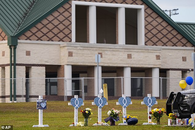 A memorial was set up outside Apalachee High School after the horrific shooting that sent parents flooding 911 call centers