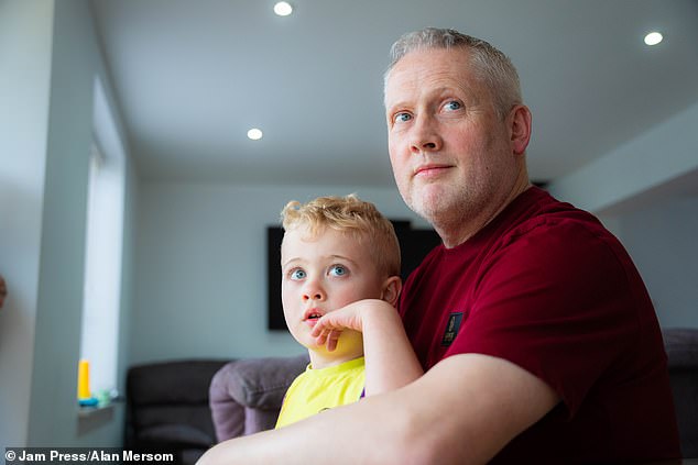 While waiting for an official diagnosis, Simon worried about whether he would be able to support his son (pictured together) and his family.