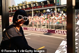 The catwalk star had the honour of waving the chequered flag at the weekend's main sporting event.