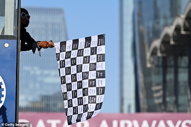 She seemed delighted to have been given the important task of waving the flag.