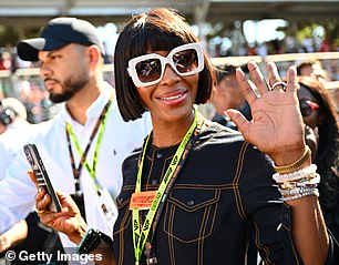 Naomi took another dip and smiled as she arrived at the weekend's main sporting event.