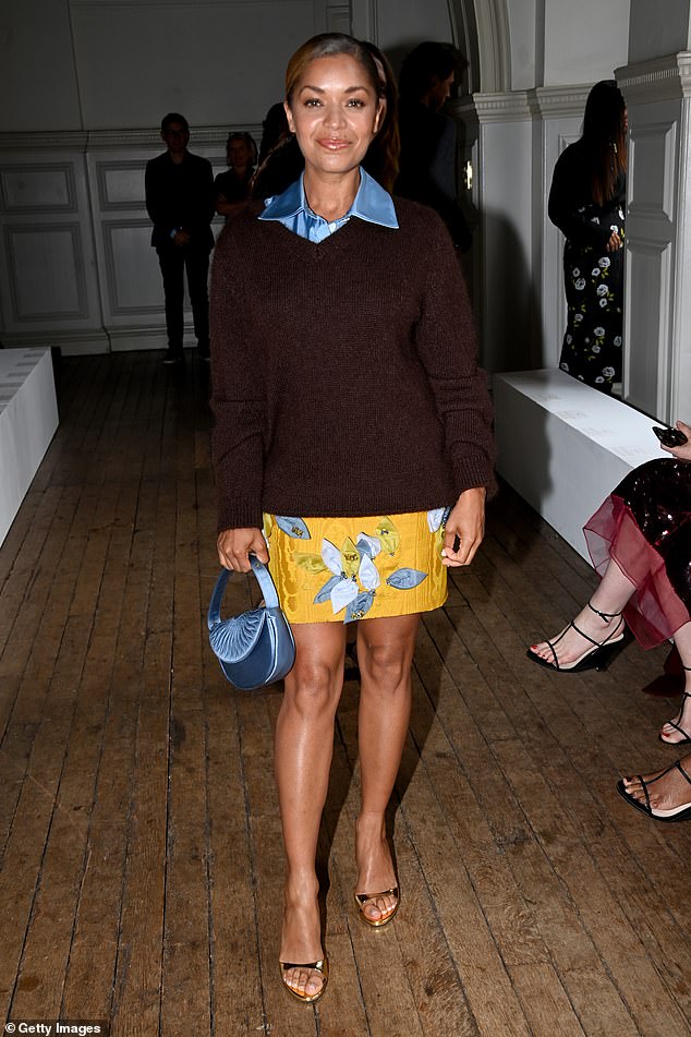 Misfits alum Antonia Thomas rocked a yellow patterned skirt and brown sweater with a silky baby blue shirt underneath.