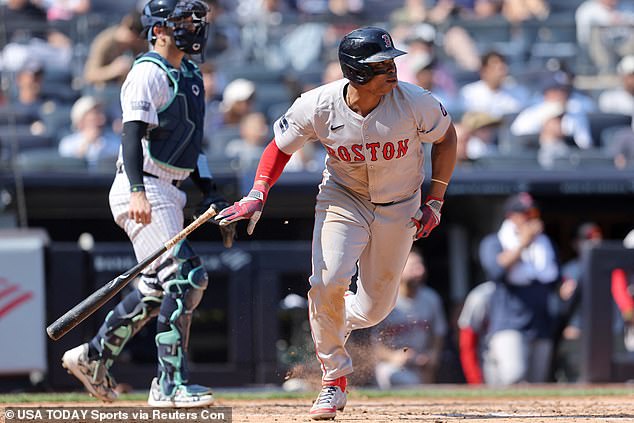 Boston Red Sox third baseman Rafael Devers (11) follows with a two-run single.