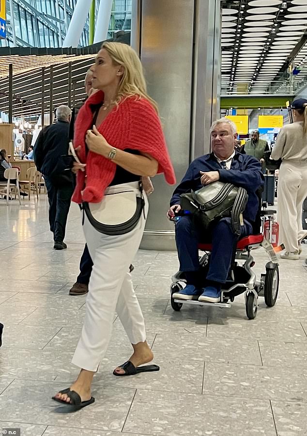 The GB News presenter, 64, and the relationship adviser, 42, touched down at Heathrow Airport after flying to Barcelona and embarking on a romantic cruise.