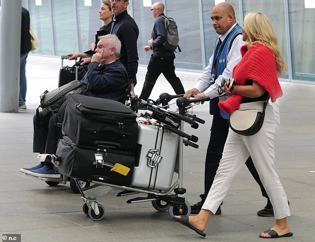 In contrast, Eamonn looked a little worn out from the holiday when the couple arrived at Heathrow, sitting in a self-driving electric wheelchair amid his crippling back problems.