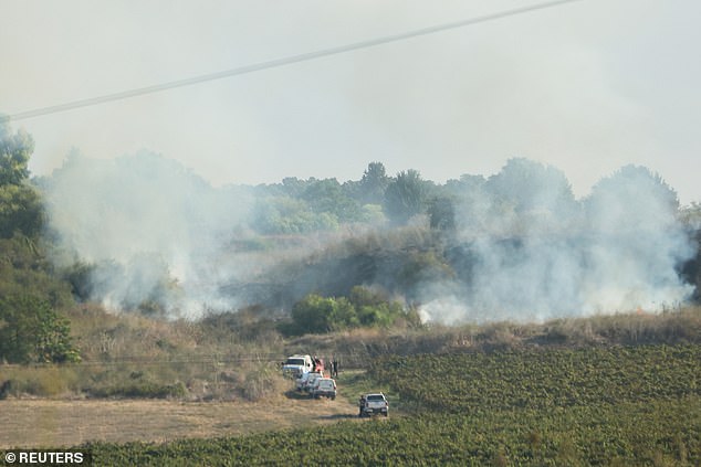 Plumes of smoke rise after a missile attack from Yemen on central Israel