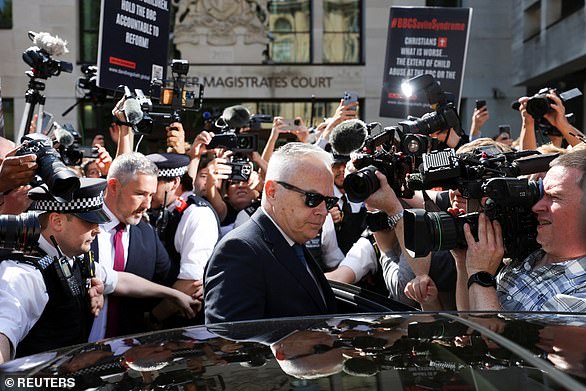 Edwards remained silent as he left the courthouse surrounded by reporters today.