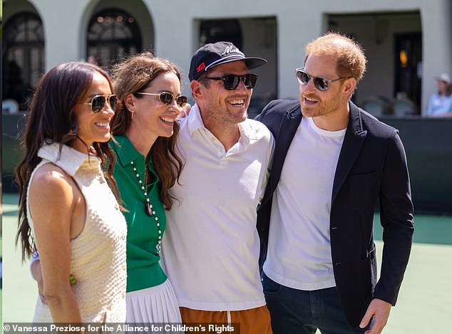 (L-R) Meghan Markle, Kelly McKee Zajfen, her husband Julian and Prince Harry attended the George Zajfen tennis tournament in Los Angeles on Saturday, a day before the duke's birthday.