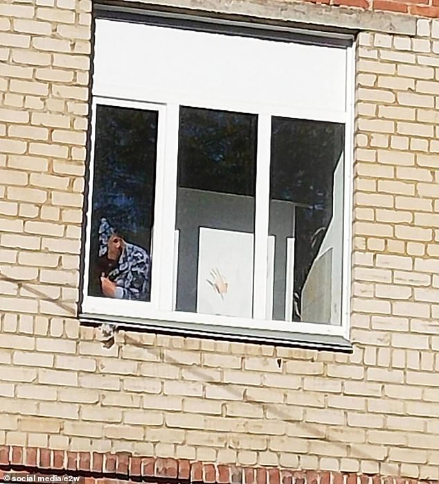 Handprint left on the window of a school in Chelyabinsk after the attack on the school.