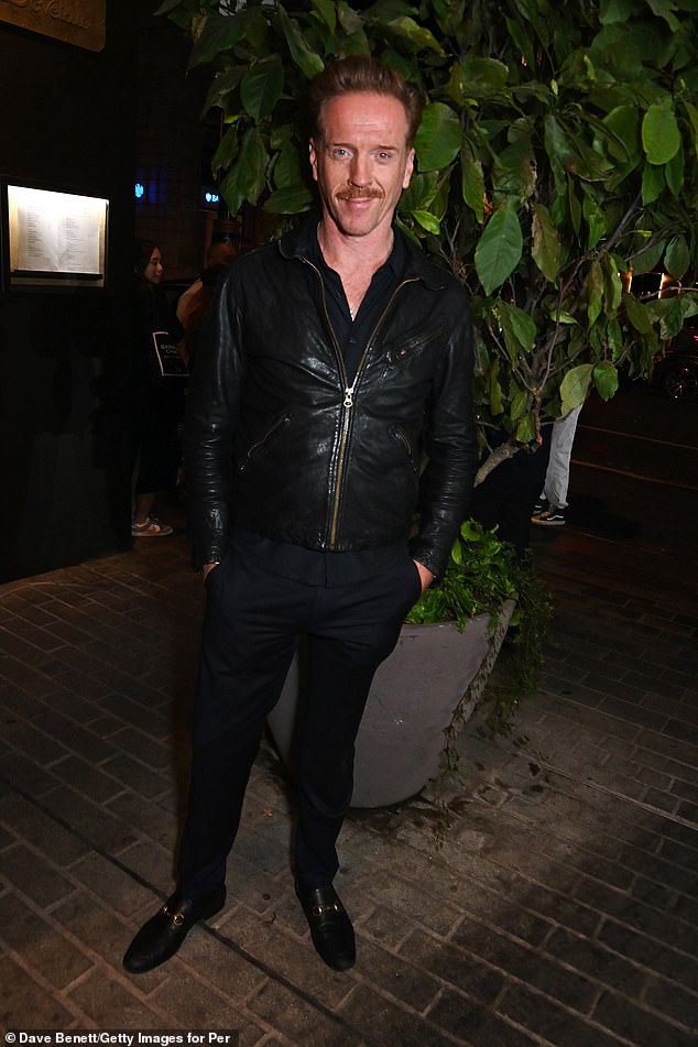 The 53-year-old actor looked handsome in a classic black leather jacket over a button-down shirt and smart navy trousers.