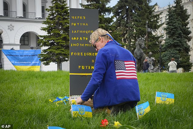 Ryan Wesley Routh pays tribute to foreign citizens killed during the war between Russia and Ukraine in a central square in kyiv, Ukraine, Saturday, April 30, 2022.