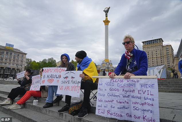 Ryan Wesley Routh, right, takes part in a demonstration in central kyiv, Ukraine, Saturday, April 30, 2022.