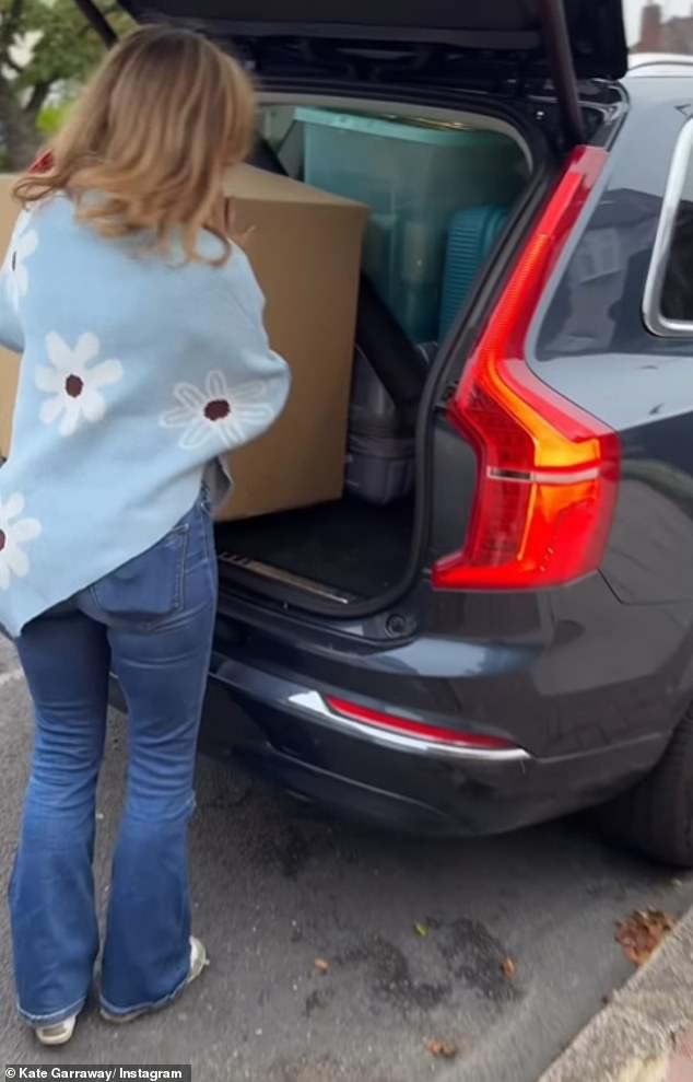 She was filmed loading boxes into the back seat of her car as it sat parked on the pavement outside her home in north London.