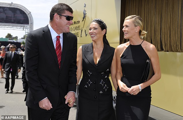 James Packer, his then wife Erica and Lachlan Murdoch's wife Sarah Murdoch arrive at the Birdcage on Derby Day at Flemington Racecourse in Melbourne.