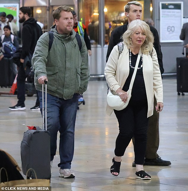 James cut a casual figure in a green jacket and jeans, carrying his essentials in a backpack.