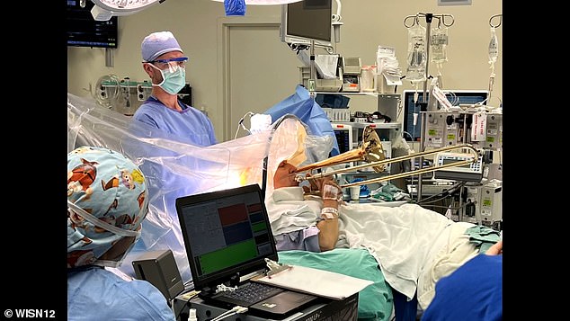 The surgery required Rust to remain awake, so he asked Lake if he could bring the trombone into the operating room. PICTURED: Dr. Wendall Lake (left) and Brian Rust (right)