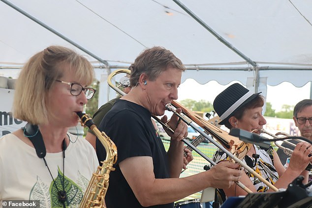 Using the trombone Rust played as a visual indicator, doctors were able to adjust the position of the wires and the amount of electrical current to be used to stabilize his hand. PICTURED: Rust performing with his dance band Six Thirty Sharp