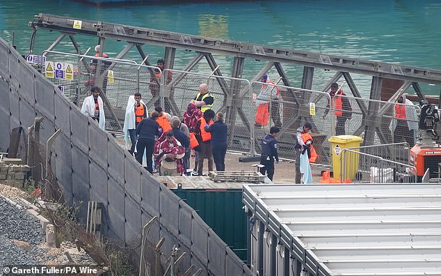 A group of people believed to be migrants are taken to Dover, Kent, from a Border Force boat following an incident with a small boat in the Channel. Pictured: 4 September 2024