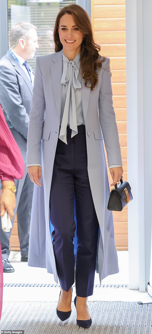 Kate looked sophisticated and smart in a silk blouse by Winser London paired with a pale blue jacket for a visit to the PIPS charity in 2023.