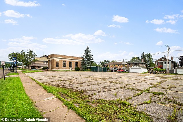 The property has ample parking and the exterior of the building has bulletproof glass.