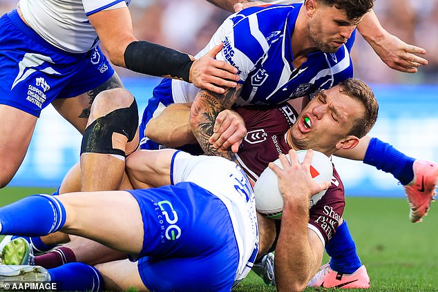 The alleged brawl erupted after Manly star Tom Trbojevic (pictured carrying the ball) defied a painful shoulder injury to play a starring role in his side's comeback.