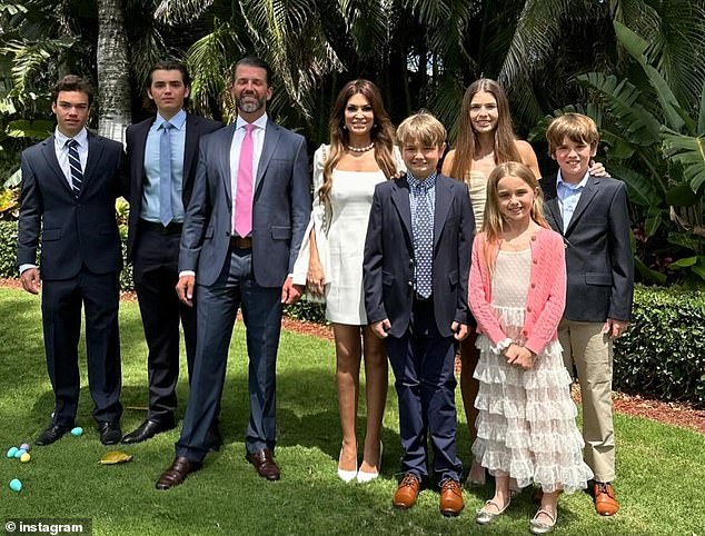 Don Jr. and Guilfoyle, 55, live in a $15.5 million oceanfront mansion in a maximum-security housing complex in Jupiter, 19 miles north of Palm Beach. They are seen posing with his five young children and her son Ronan (far left) earlier this year at Easter.